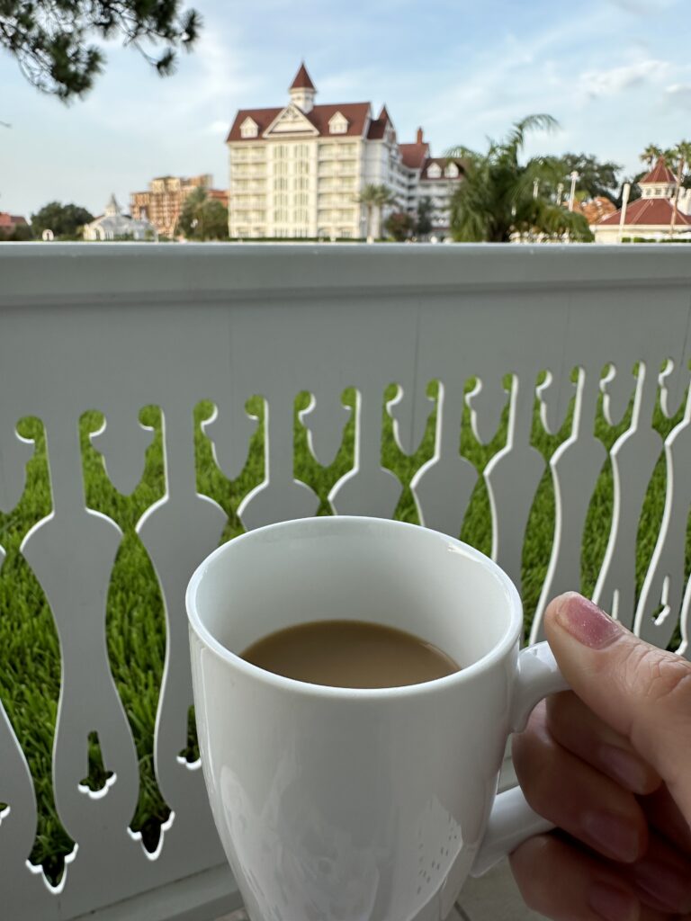 Morning coffee on the last day at Walt Disney World overlooking a Disney resort balcony.