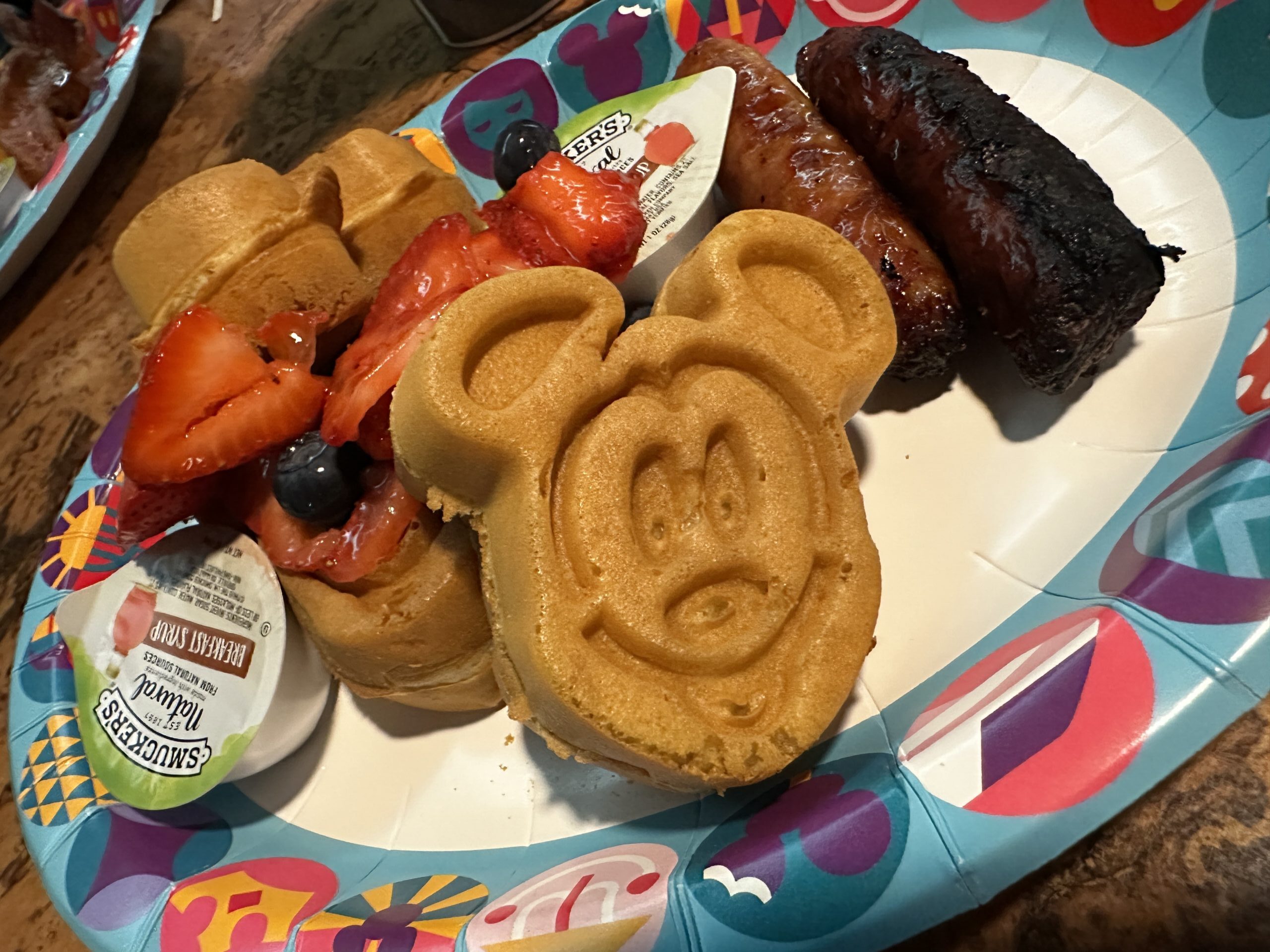 Mickey waffles with fruit and sausage on the last day at Walt Disney World.