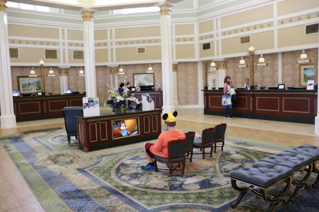 child waiting in hotel lobby